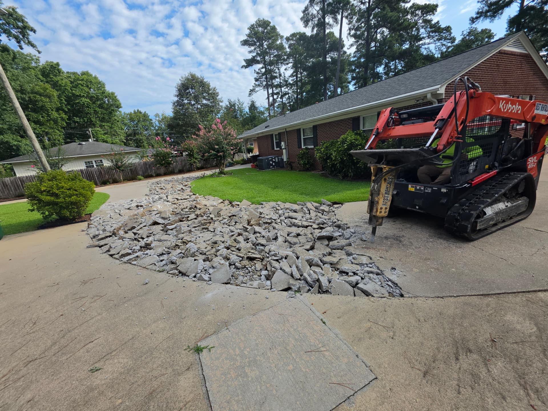 Alpha Concrete breaking out an old driveway for replacement