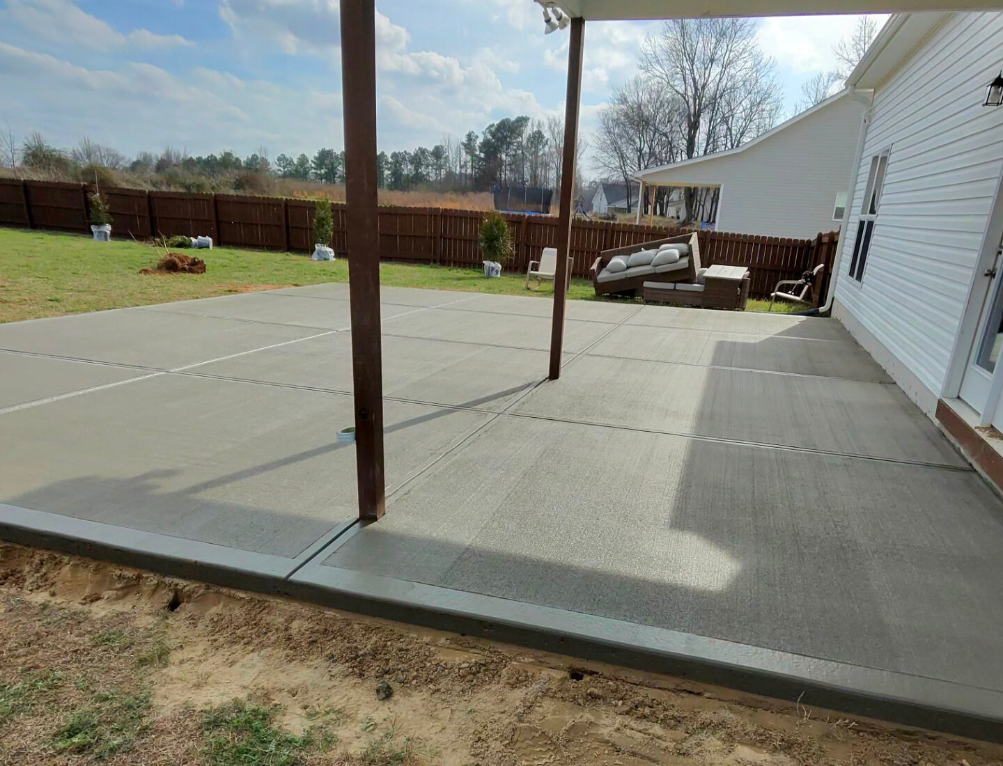 New concrete patio poured by Alpha Concrete