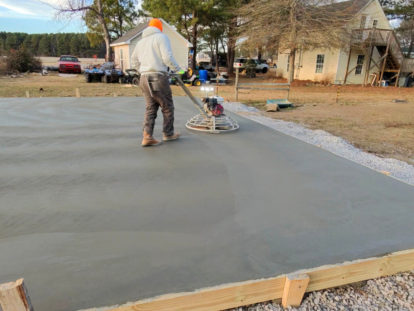 Concrete shop slab being power troweled by Alpha Concrete